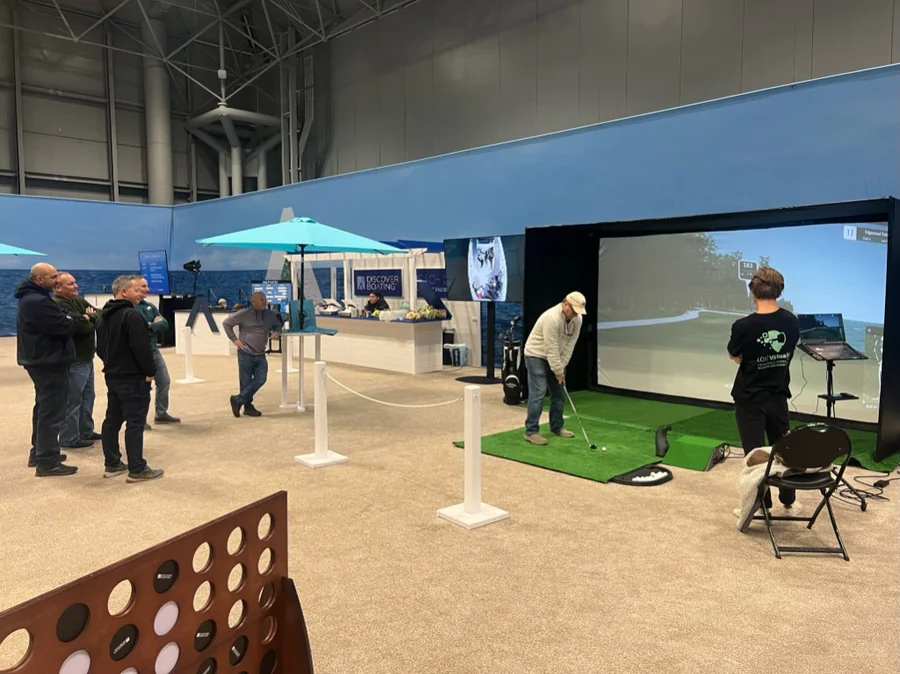 Mobile golf simulator setup in Boston for galas, receptions, and hospitality lounges
