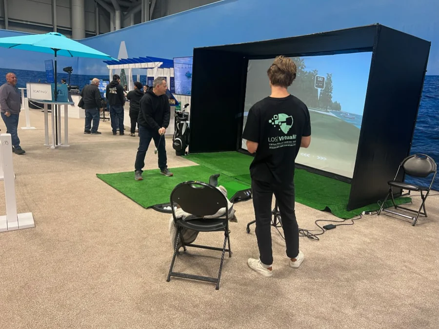 Virtual golf for hire in Boston: projector, turf, clubs, and tournament-style gameplay