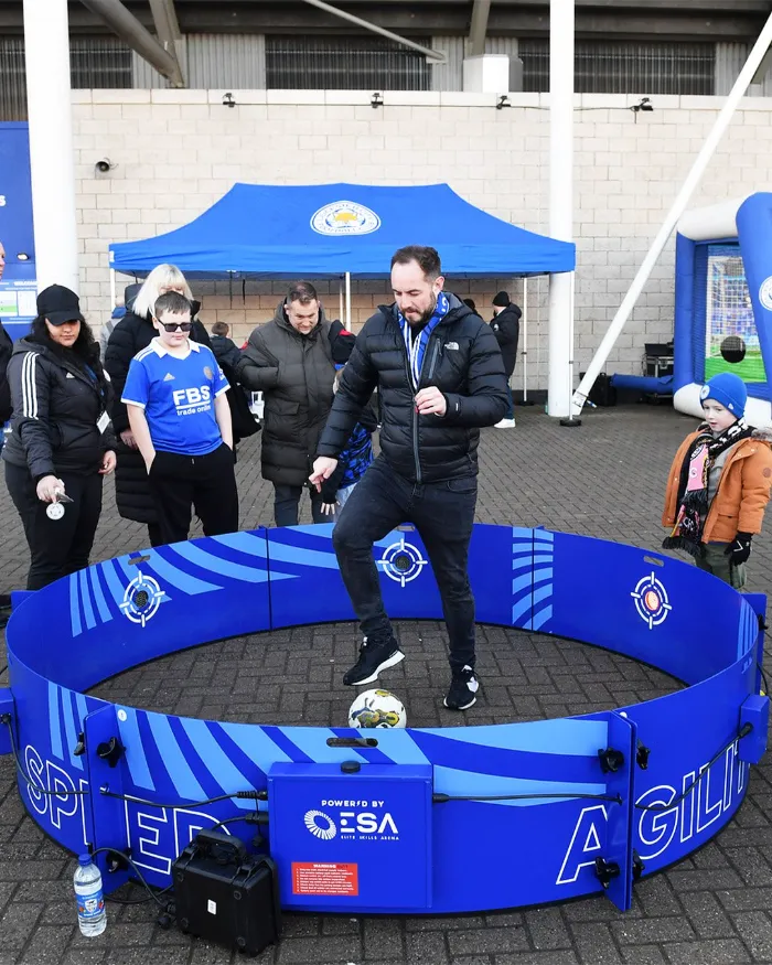 Player training footwork and speed inside the soccer reaction ring rental