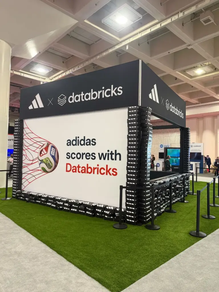Adidas x Databricks branded soccer activation booth with artificial turf at Data + AI Summit in San Francisco