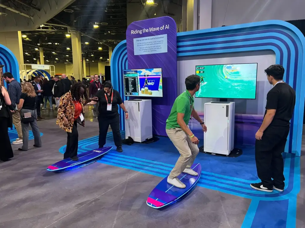 Attendee riding a branded surf simulator in the KPMG booth at Oracle AI World 2025, Las Vegas