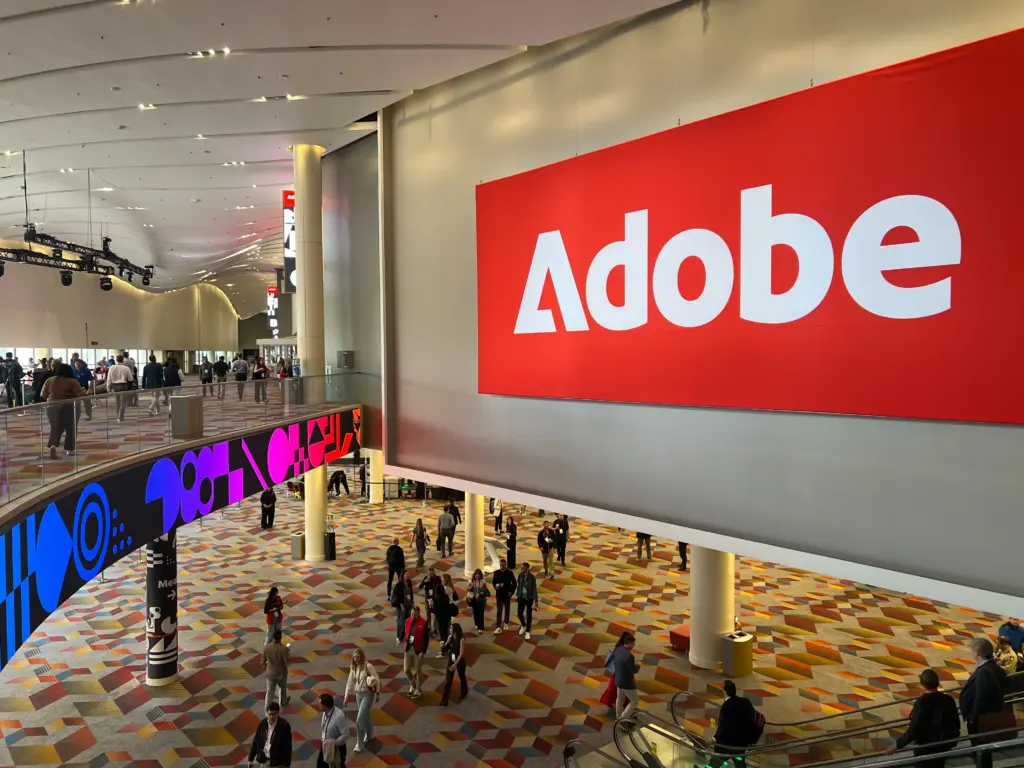 Adobe Summit 2026 banner over the busy main hall at the Venetian Expo in Las Vegas