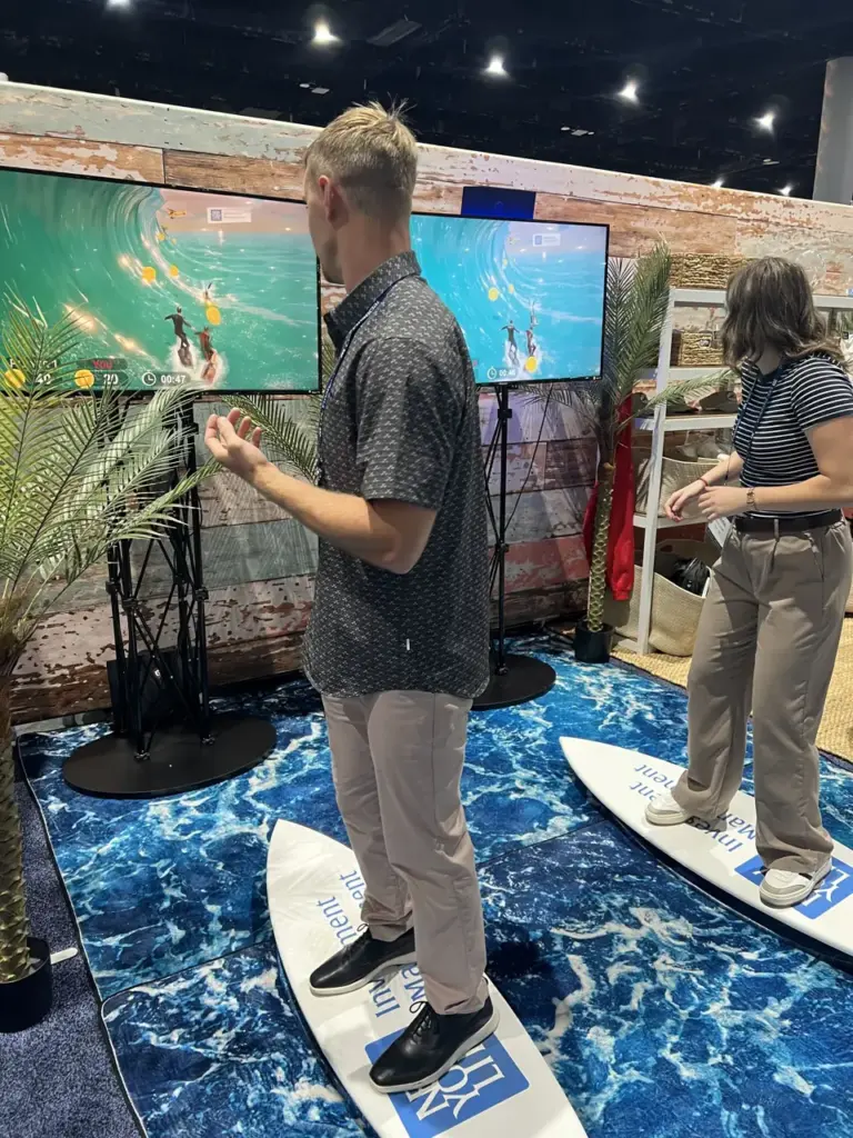 Attendees riding New York Life Investments branded surf simulators at LPL Focus 2026, San Diego Convention Center