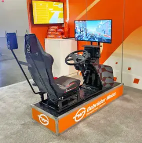Truck simulator rental with a driver's seat, steering wheel and screens at a trade show booth