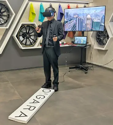 Guest in a VR headset walking a narrow plank in the Walk the Plank VR experience at a trade show