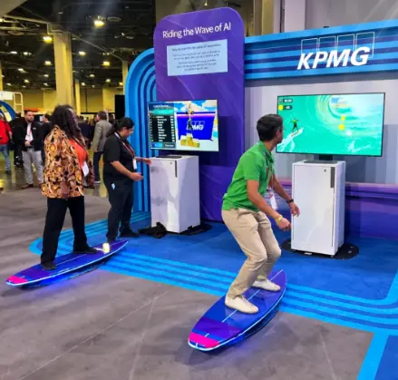 Guest riding a surf simulator rental at a branded trade show booth